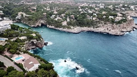 A drone shot from above of the beach Cala Santany Balearic Islands Spain Stock Footage 315958745