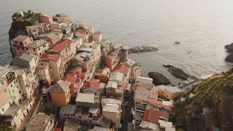 Drone shot above italian small old town Manarola in sunset Stock Footage