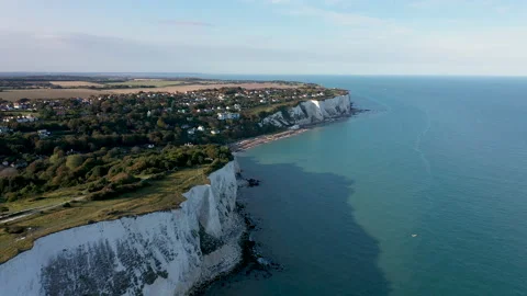 Drone shot above white cliffs and the sea towards a secluded bay. 4k Stock Footage 147364840