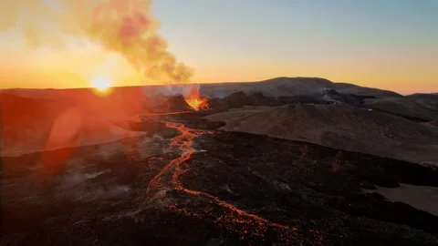 Drone Shot of Active Volcano With Lava River at Sunset 動画素材 329273659