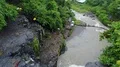 Drone shot aerial above wild rock waterfall tropic palm tree rainforest Bali 4k 4k or 4k+ Resolution