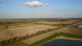 Drone shot aerial countryside landscape with irrigation traveling sprinkler 4k or 4k+ Resolution