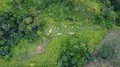 Drone shot aerial descent over graveyard in jungle mountains beautiful Indonesia 4k or 4k+ Resolution