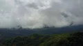 Drone shot aerial green jungle mountains cloudscape and hidden village Indonesia 4k or 4k+ Resolution