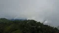 Drone shot aerial green jungle mountains cloudscape and hidden village Indonesia 4k or 4k+ Resolution