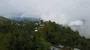 Drone shot aerial green jungle mountains cloudscape and hidden village Indonesia 4k or 4k+ Resolution