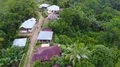 Drone shot aerial jungle mountain village buildings and footpath Indonesia 4k or 4k+ Resolution