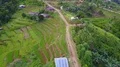 Drone shot aerial jungle mountain village buildings and footpath Indonesia 4k or 4k+ Resolution