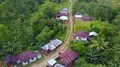Drone shot aerial jungle mountain village buildings and footpath Indonesia 4k or 4k+ Resolution