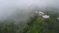 Drone shot aerial jungle mountain village covered in clouds beautiful Indonesia 4k or 4k+ Resolution