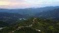 Drone shot aerial jungle mountain peak and village buildings beautiful Indonesia 4k or 4k+ Resolution