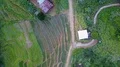 Drone shot aerial jungle mountains and village buildings beautiful Indonesia 4k or 4k+ Resolution