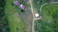 Drone shot aerial jungle mountains and village buildings beautiful Indonesia 4k or 4k+ Resolution