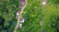 Drone shot aerial jungle mountains and village buildings beautiful Indonesia 4k or 4k+ Resolution