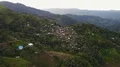 Drone shot aerial jungle mountains and village buildings beautiful Indonesia 4k or 4k+ Resolution
