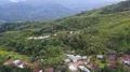Drone shot aerial jungle mountains and village buildings beautiful Indonesia 4k or 4k+ Resolution
