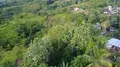 Drone shot aerial jungle mountains and village buildings beautiful Indonesia 4k or 4k+ Resolution