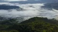 Drone shot aerial jungle mountains and village above clouds in Indonesia 4k or 4k+ Resolution