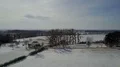 Drone shot aerial snow-white frozen countryside low mountain range panning 4k or 4k+ Resolution