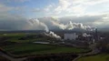 Drone shot aerial sugar factory with smoking chimney at sunny autumn day 4k or 4k+ Resolution