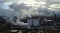 Drone shot aerial sugar factory with smoking chimney at sunny autumn day 4k or 4k+ Resolution