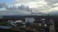 Drone shot aerial sugar factory with smoking chimney at sunny autumn day 4k or 4k+ Resolution
