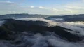Drone shot aerial tilt down fog clouds and jungle mountains beautiful Indonesia 4k or 4k+ Resolution
