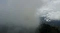 Drone shot aerial touching clouds over jungle mountains beautiful Indonesia 4k or 4k+ Resolution