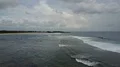 Drone shot aerial tropic beach and foamy seashore waves tourism paradise Bali 4k or 4k+ Resolution
