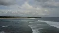 Drone shot aerial tropic beach and foamy seashore waves tourism paradise Bali 4k or 4k+ Resolution
