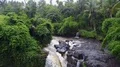 Drone shot aerial wild rock waterfall in tropic palm tree rainforest Bali 4k 4k or 4k+ Resolution