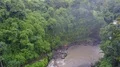 Drone shot aerial wild rock waterfall in tropic palm tree rainforest Bali 4k 4k or 4k+ Resolution