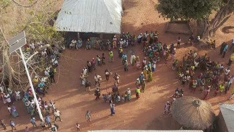 Drone shot of an African tribe singing, dancing in circles and drumming. Stock Footage 138463117
