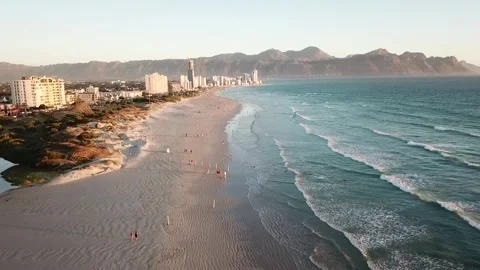 Drone shot along Strand Beach with city views Stock Footage 256205227