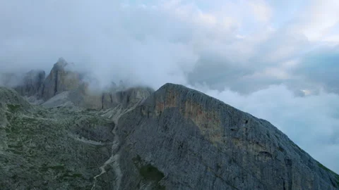 Drone Shot of Alpine Mountain Ridge in the Clouds in the Dolomites Stock Footage 220503181