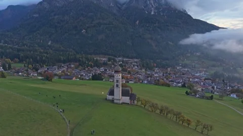 Drone shot of alpine St. Valentin church and mountains, South Tyrol. Stock Footage 321546179