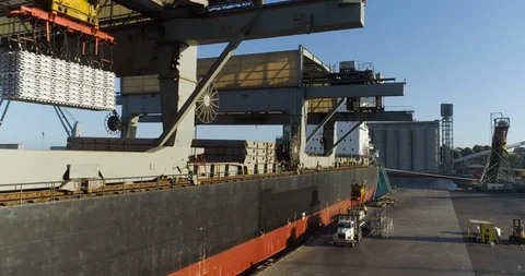 Drone shot of aluminium ingots being loaded at Australian port at sunset. Stock Footage 86852896