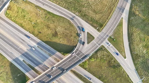 Drone shot from an angle above and below a road intersection Stock Footage 316544200