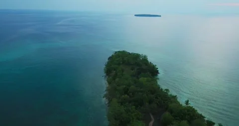 Drone shot approaching remote Morotai tropical island coastline Stock Footage 328901193