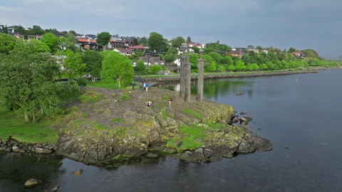 Drone shot approaching Sverd i Fjell monument with Stavanger suburb behind. Stock Footage 328131403