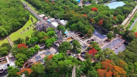 Drone shot aqua cleansing facility near forested terrain Stock Footage 312034169