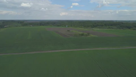 Drone shot of arable land after seeding and blue sky, clouds Stock Footage 130593501