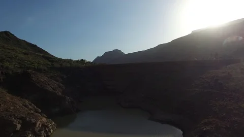 Drone shot of a backlit dam on sunset Stock Footage 97003233