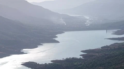 Drone shot of backwaters of a Dam during daytime 4K60 스톡 동영상 332893234