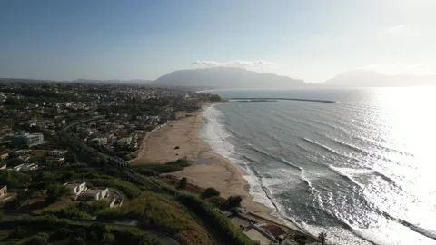 Drone shot of Balestrate with waves gently touching the sandy beach. Stock Footage 270785077