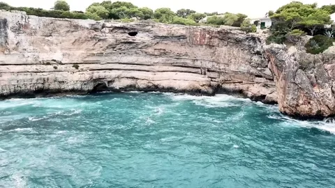 A drone shot of the bay of Cala Santany Balearic Islands Spain Stock Footage 315958752