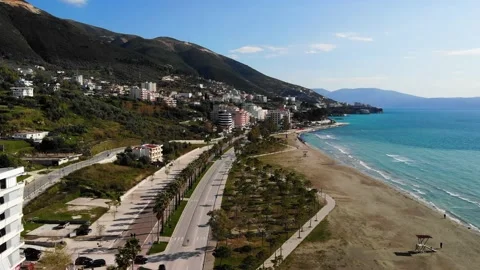 Drone Shot of the Beach in a Bright Day with Palm Trees and Blue Water Stock Footage 152932207