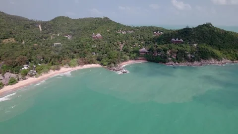 Drone shot of a Beach with Trees and forest, Buildings,Sunny Daytime,Koh Phangan Stock Footage 279165424