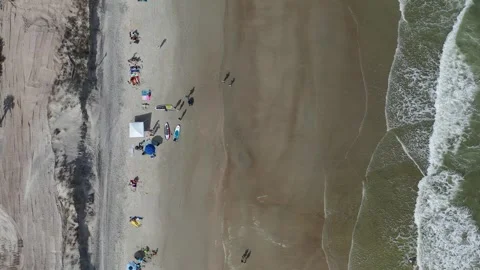 Drone Shot of Beachgoers at Tybee Beach in Savannah Stock Footage 245320426