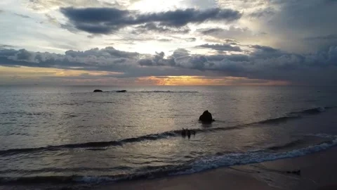 A drone shot of the beachside with the sunset srilanka Stock Footage 305523749
